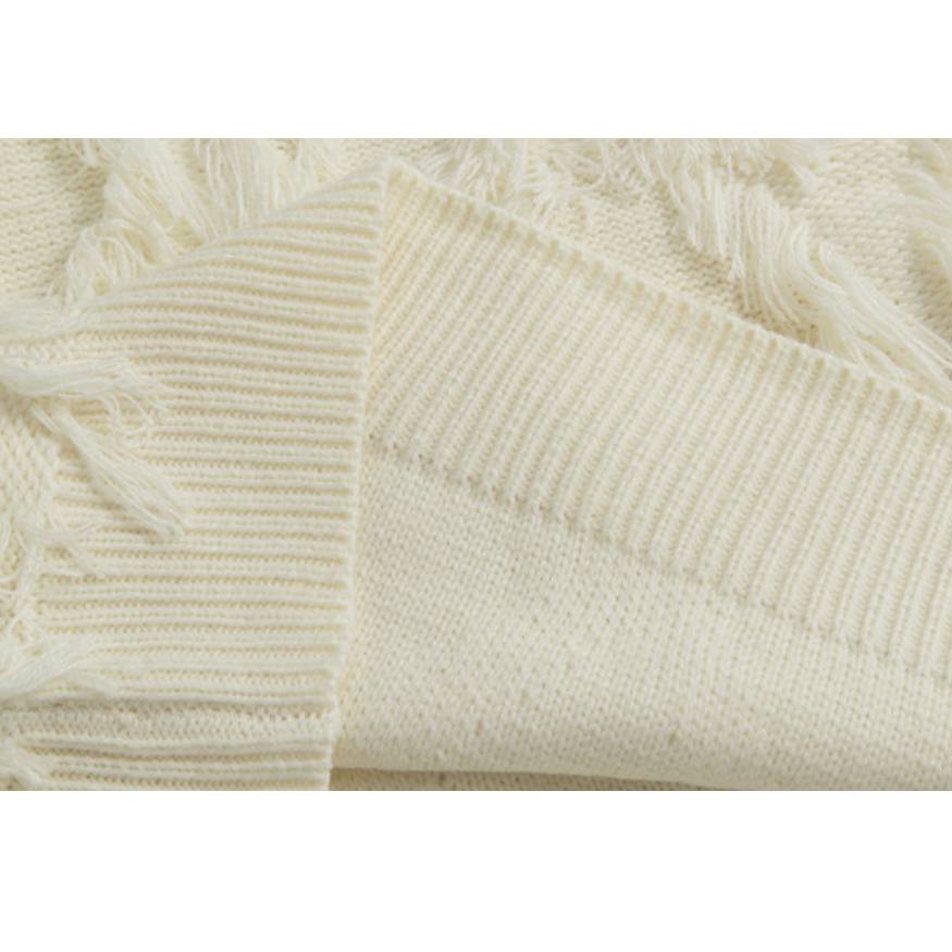 Stilvoller Strickpullover mit Quaste