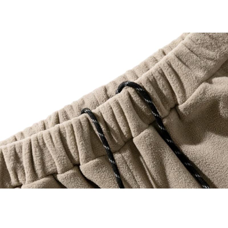 Pantalones utilitarios de polar holgados con bolsillos espaciosos