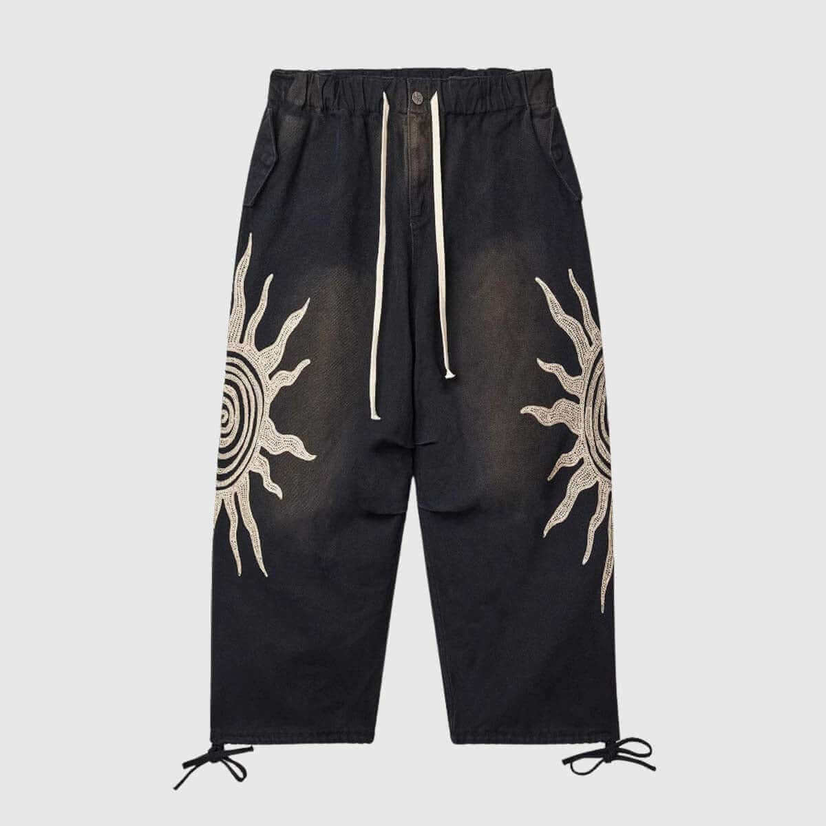 Sun graphic drawstring pants featuring a bold sun design, relaxed fit, and adjustable waist for comfort.