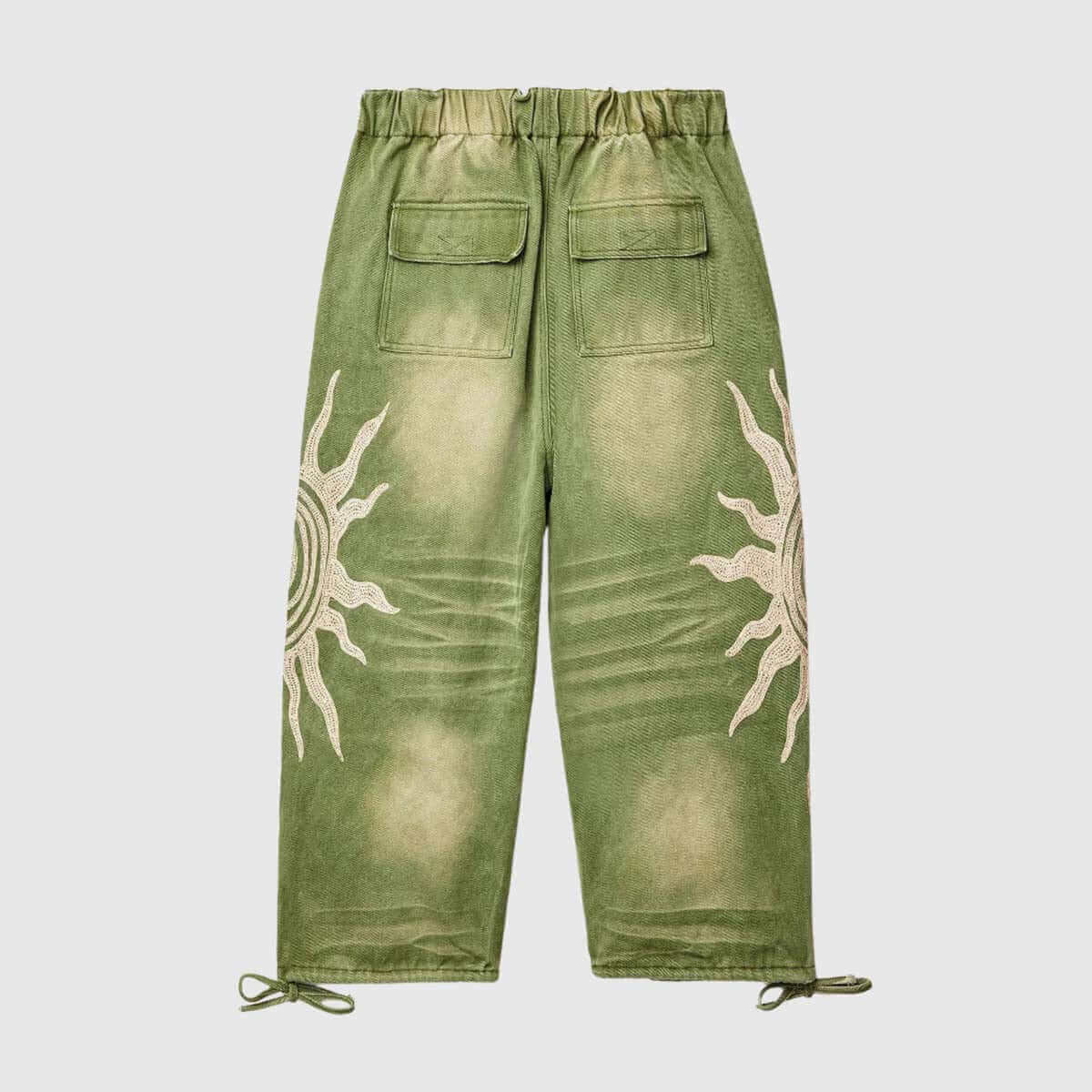 Sun graphic drawstring pants in green with loose fit, adjustable waist, and unique sun design.
