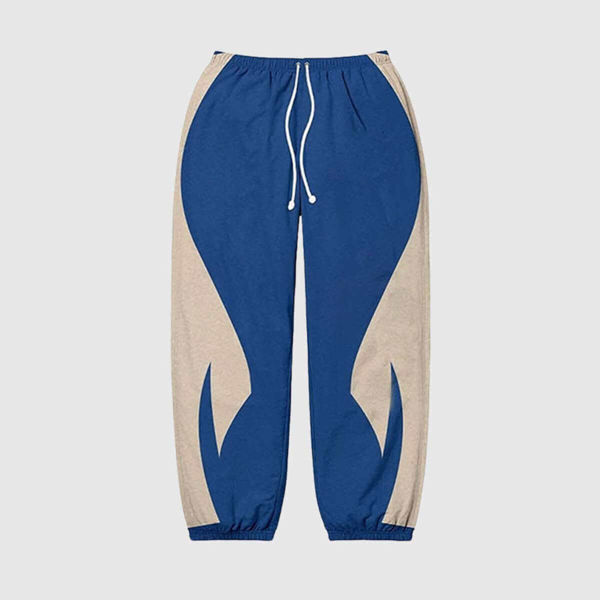 Y2K-inspired colorblock joggers in blue and beige with elastic waistband and drawstring, perfect for casual or street style.