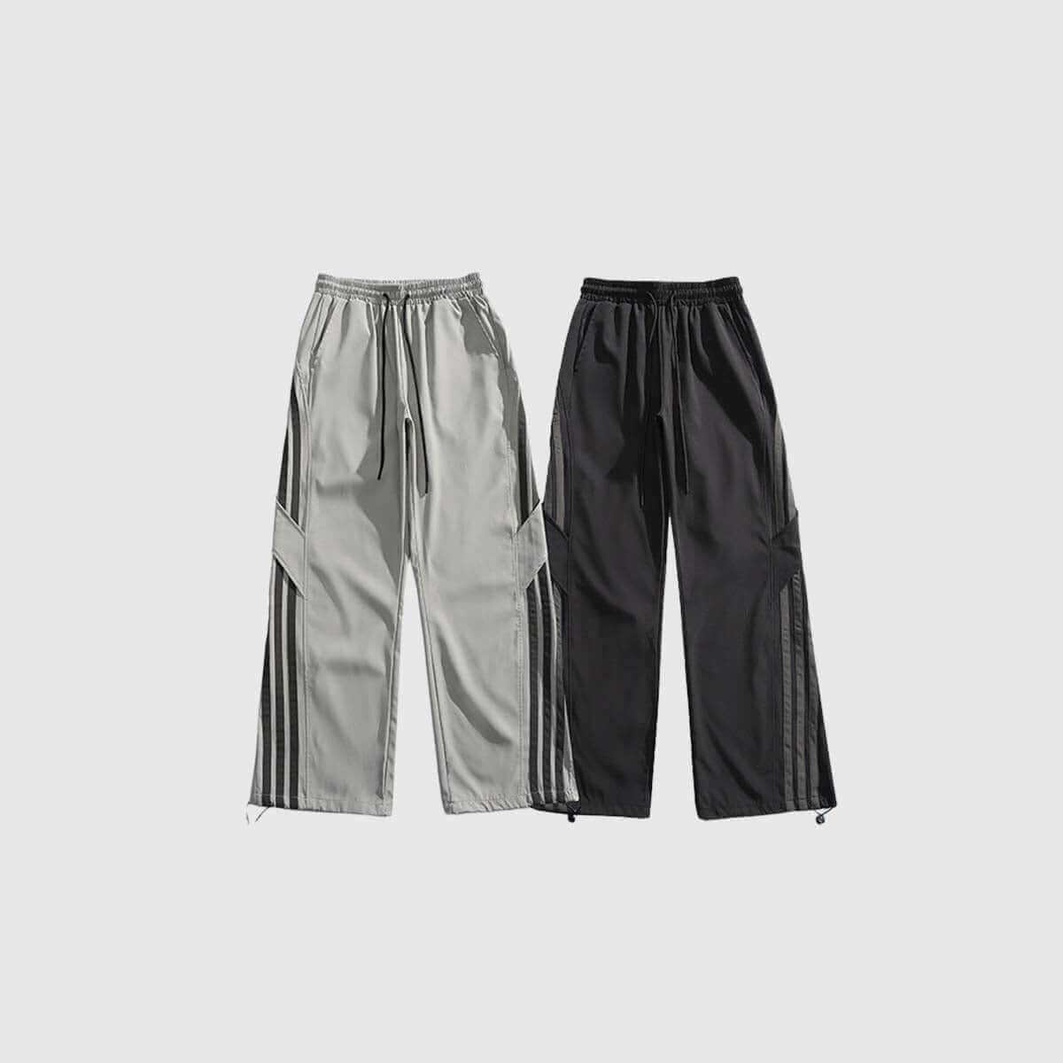 Side stripe sweatpants in gray and black, featuring adjustable waistbands for a sporty look and comfortable fit.