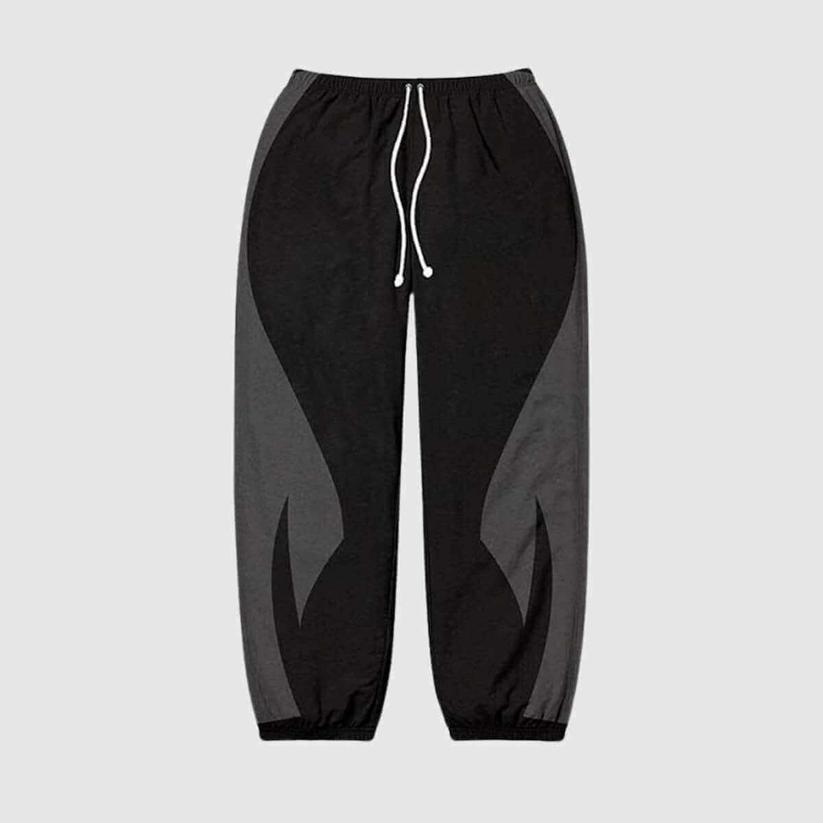 Black and gray color block joggers with elastic waistband and adjustable drawstring for casual wear.