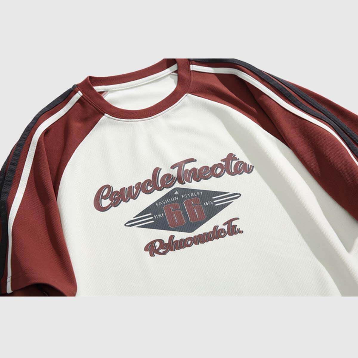 Vintage graphic raglan shirt featuring bold 'Route 66' print and maroon sleeves for a casual, stylish look.