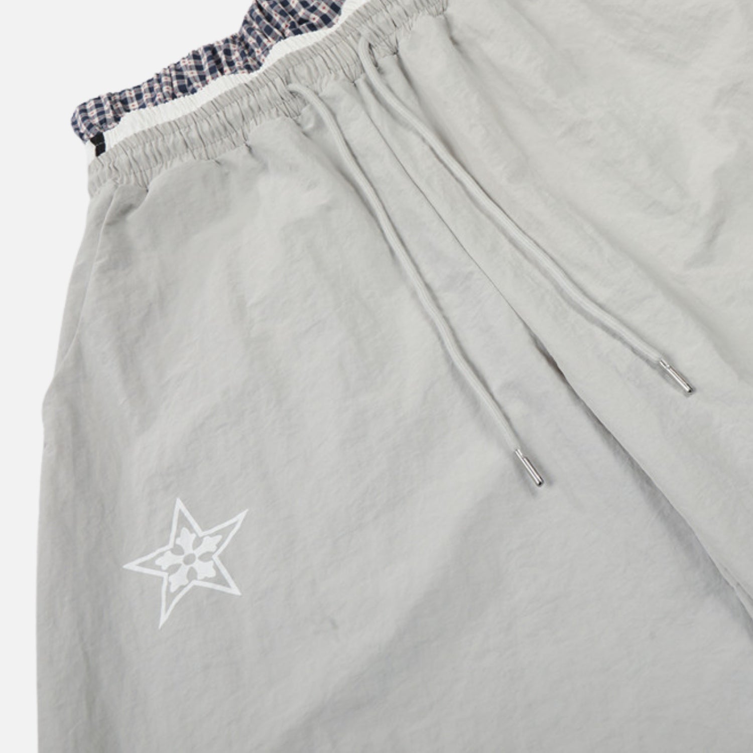 Pantalones de doble cintura con efecto de doble capa