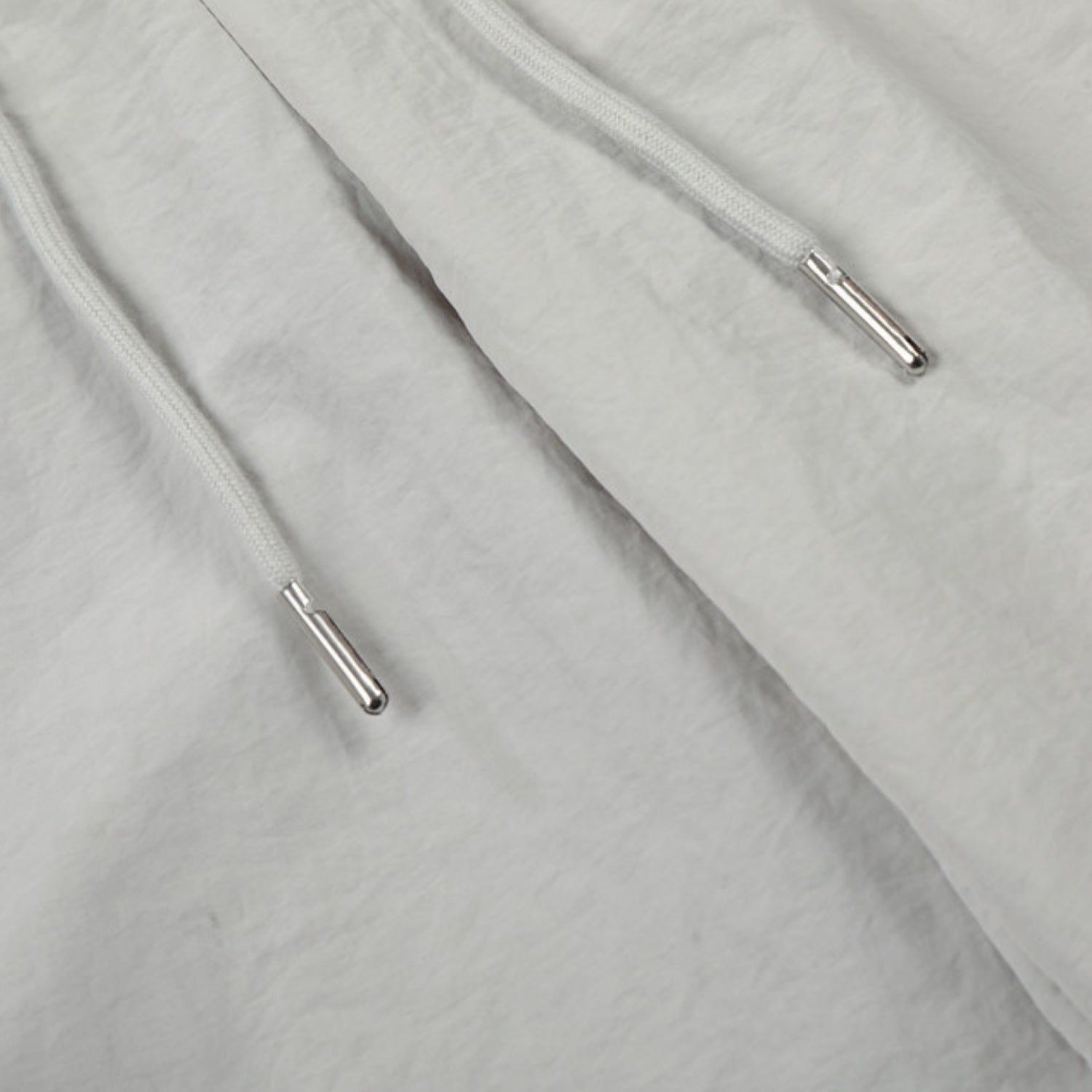 Pantalones de doble cintura con efecto de doble capa