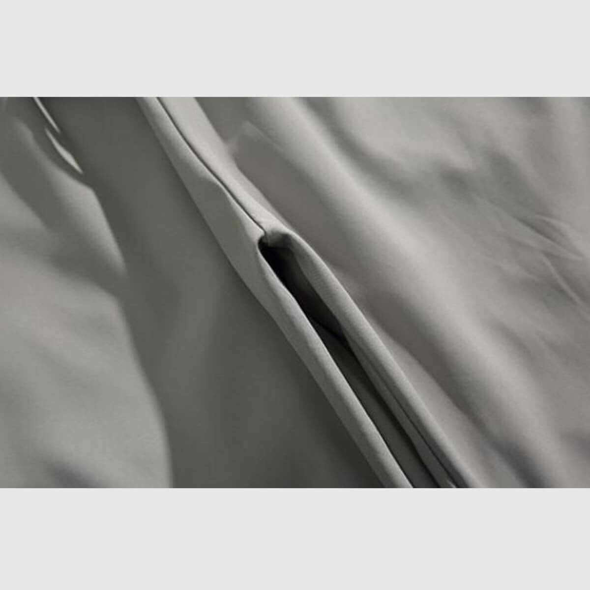 Close-up of side stripe sweatpants fabric showing bold stripes and soft material for comfort and style.