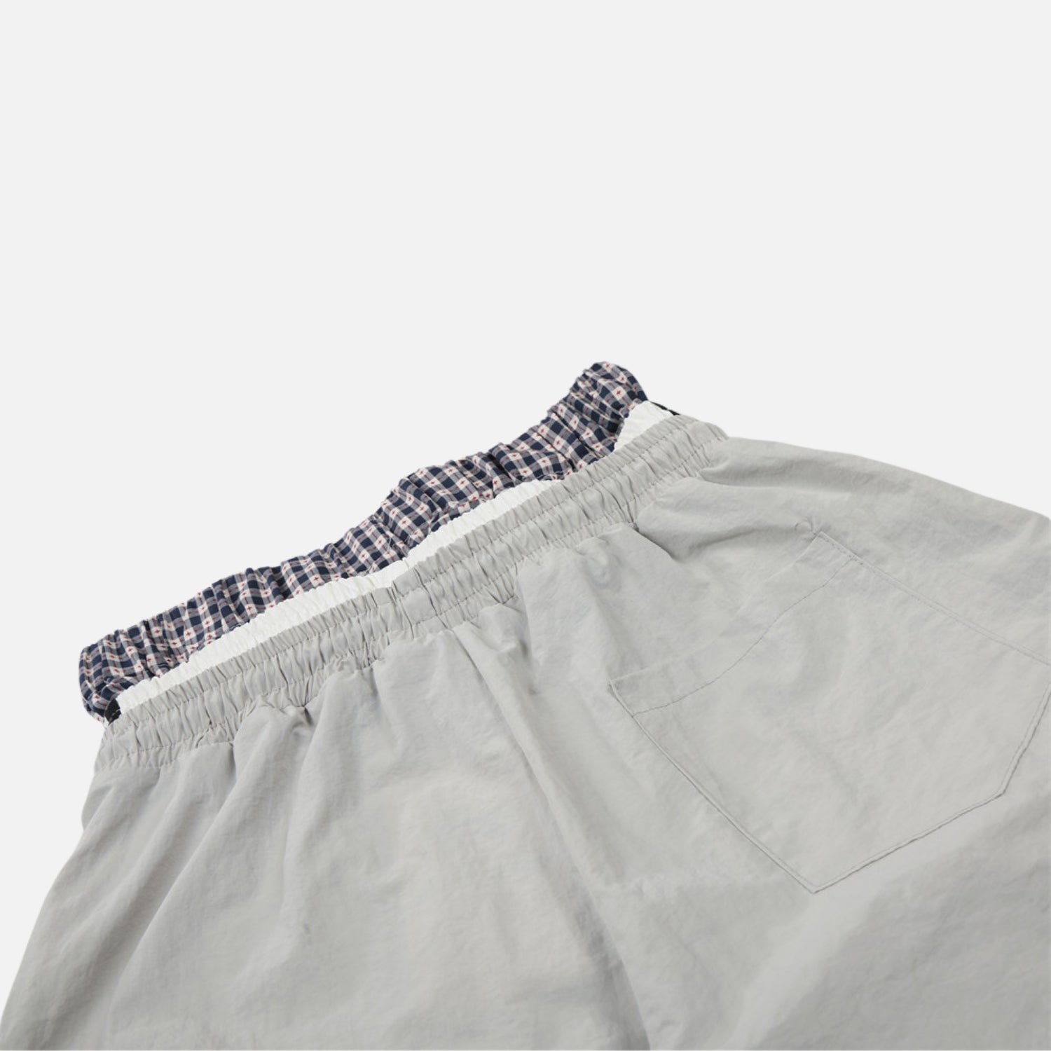 Pantalones de doble cintura con efecto de doble capa