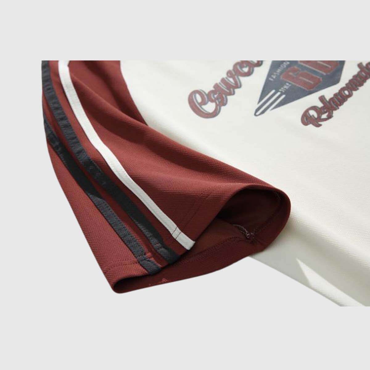 Close-up of vintage graphic raglan shirt sleeve with bold 'Route 66' print and stylish maroon color blocking.