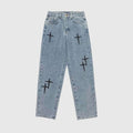 Jeans en denim à broderie croisée
