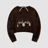 Kurzer Pullover mit Neckholder-Stickerei und Quaste